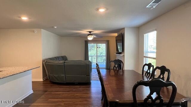 dining room featuring ceiling fan and dark hardwood / wood-style flooring