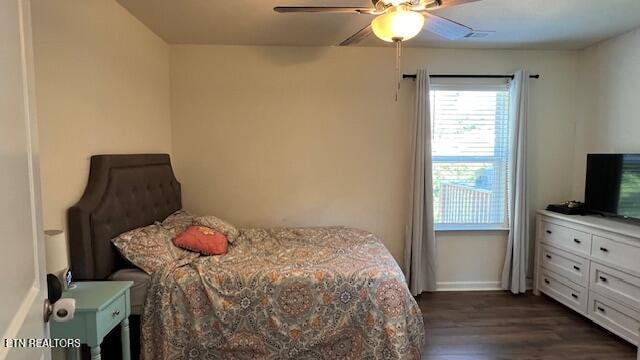 bedroom featuring dark hardwood / wood-style flooring and ceiling fan