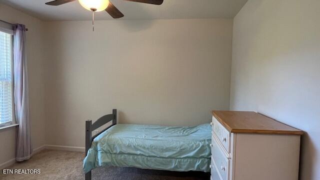 carpeted bedroom featuring ceiling fan