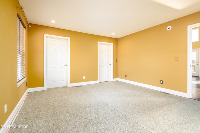 unfurnished bedroom with carpet flooring