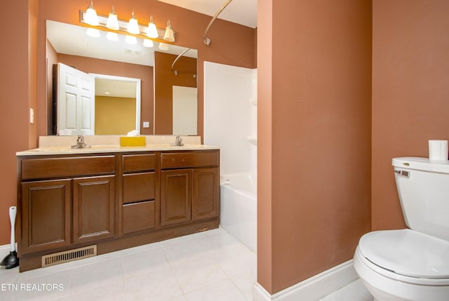 bathroom featuring a bathing tub, tile patterned flooring, vanity, and toilet