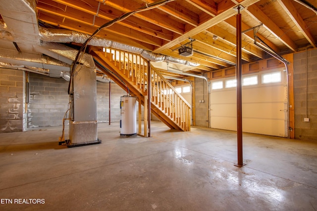 basement featuring heating unit and water heater