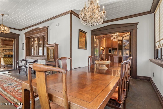 dining room with ornamental molding and wood ceiling