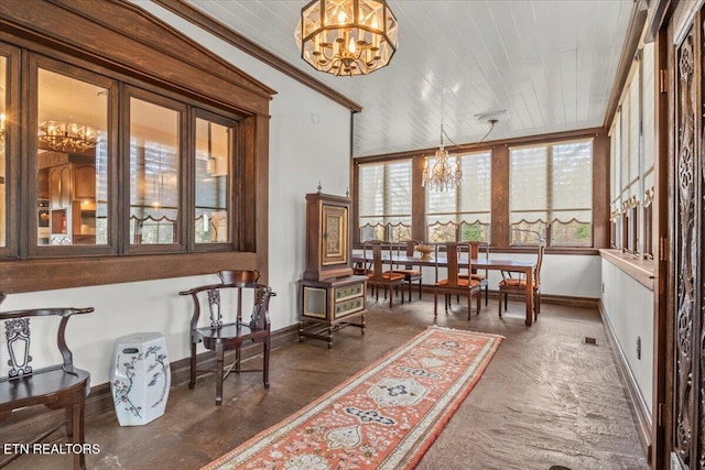 sunroom featuring a notable chandelier