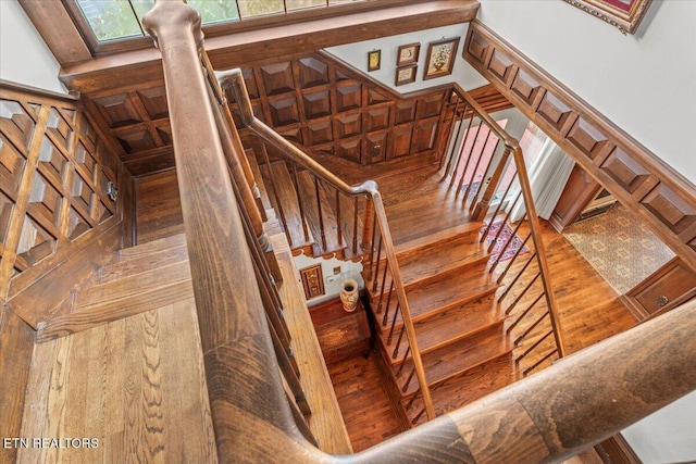 stairs with hardwood / wood-style floors