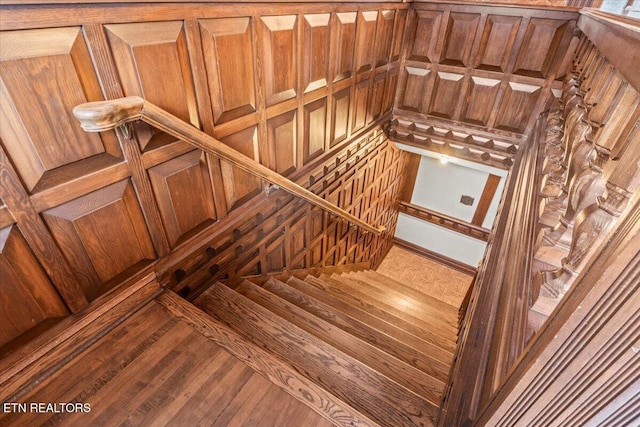 stairway featuring hardwood / wood-style flooring