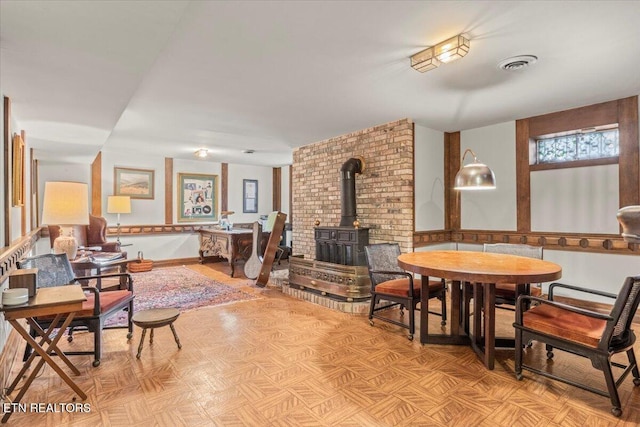 dining area with a wood stove