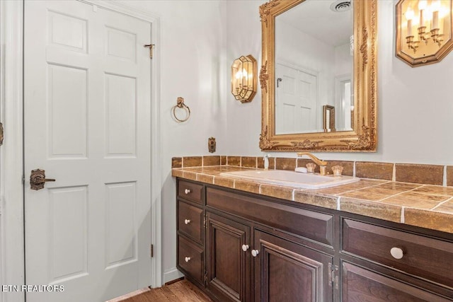 bathroom featuring hardwood / wood-style floors and vanity