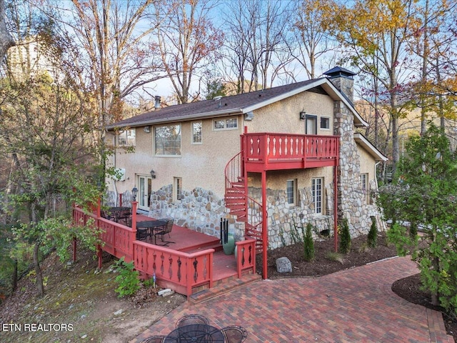 rear view of house with a deck