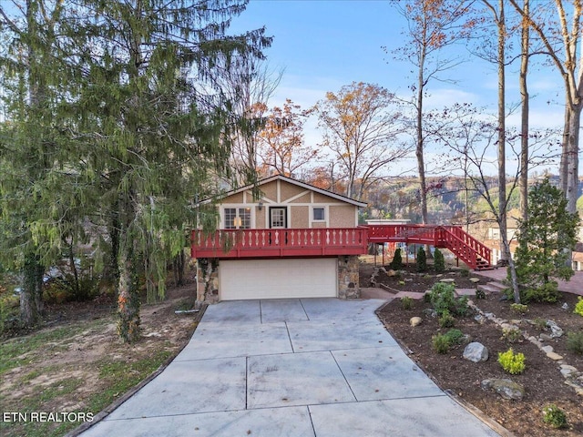 view of front facade featuring a garage and a deck with mountain view