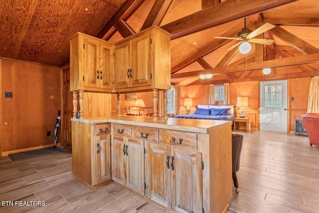 kitchen with lofted ceiling with beams, ceiling fan, and light hardwood / wood-style flooring