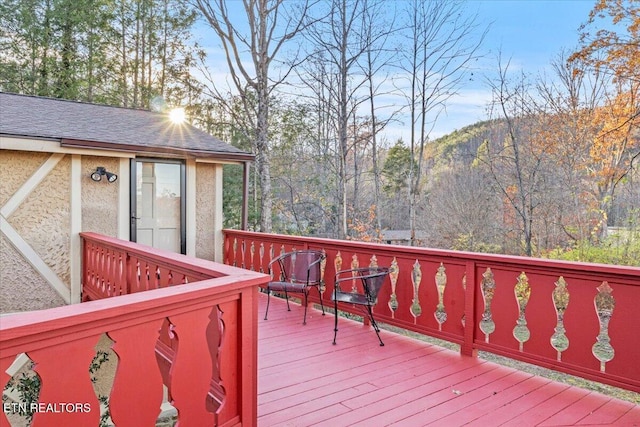 wooden terrace with a mountain view