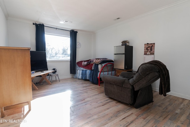 living room with hardwood / wood-style floors and crown molding