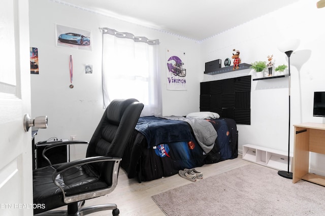 bedroom featuring hardwood / wood-style floors