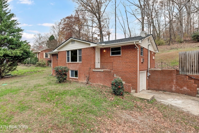 exterior space with a garage and a lawn