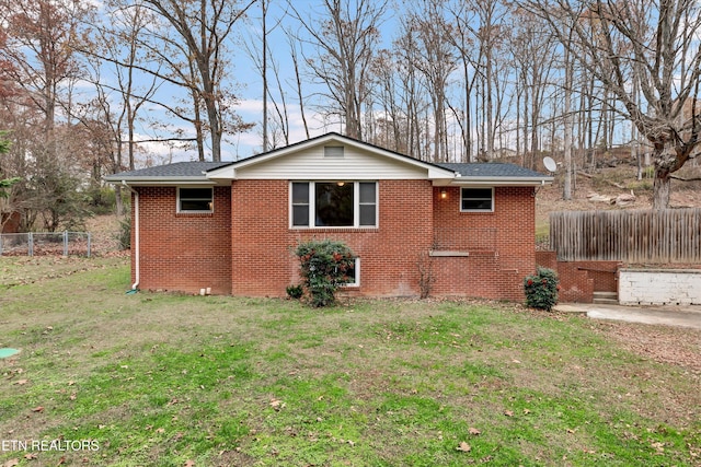 view of side of property featuring a yard