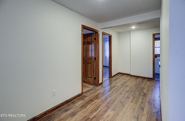 unfurnished room featuring hardwood / wood-style flooring