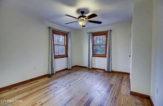 unfurnished room with light hardwood / wood-style floors and ceiling fan