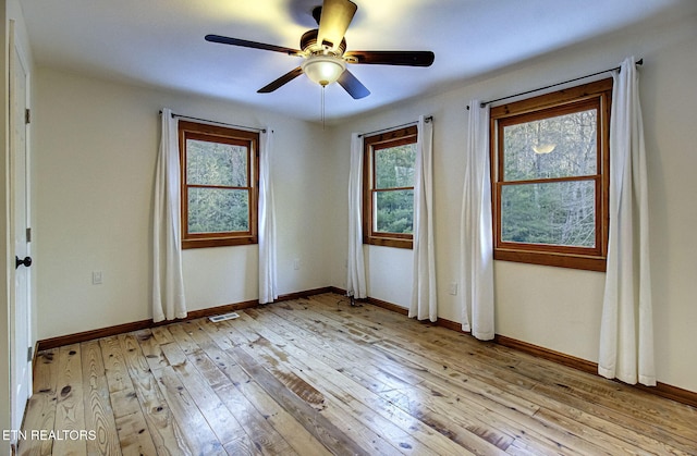 unfurnished room featuring light wood-type flooring and ceiling fan