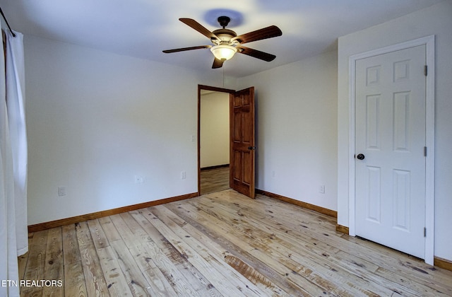 unfurnished bedroom featuring ceiling fan and light hardwood / wood-style flooring