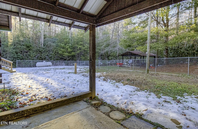 view of yard layered in snow