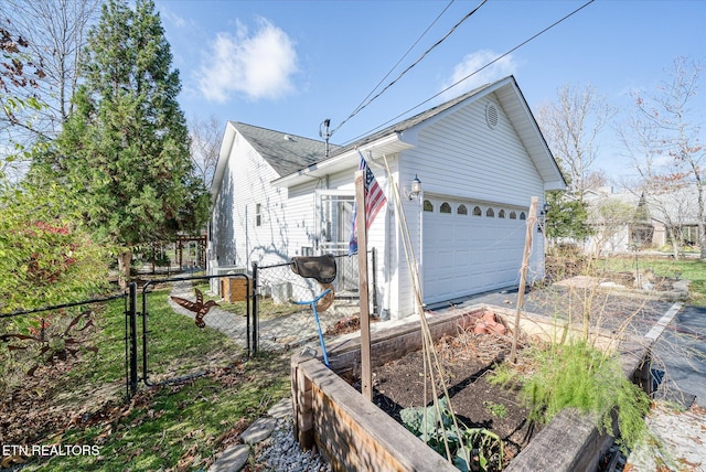 view of property exterior with a garage