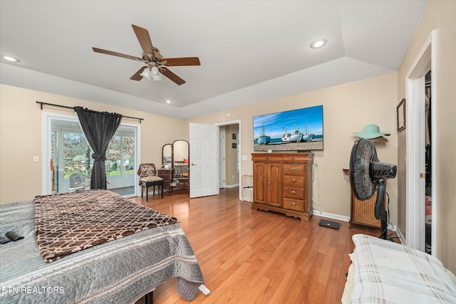 bedroom with light wood-type flooring, access to outside, and ceiling fan