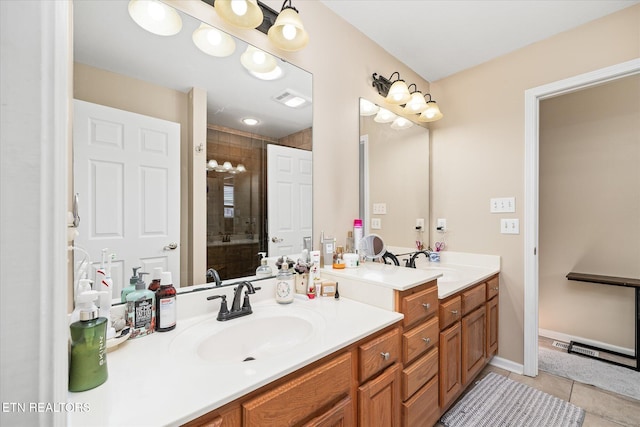 bathroom featuring tile patterned flooring, vanity, and a shower with shower door