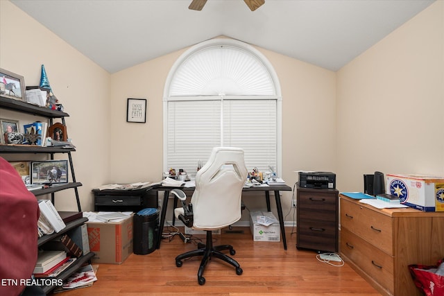 home office featuring vaulted ceiling, light hardwood / wood-style flooring, and ceiling fan