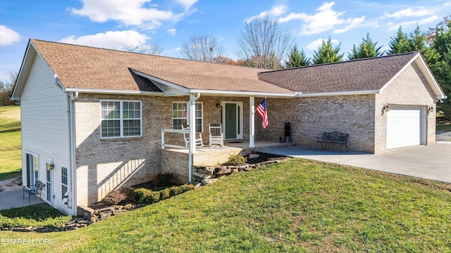 single story home featuring a garage and a front lawn