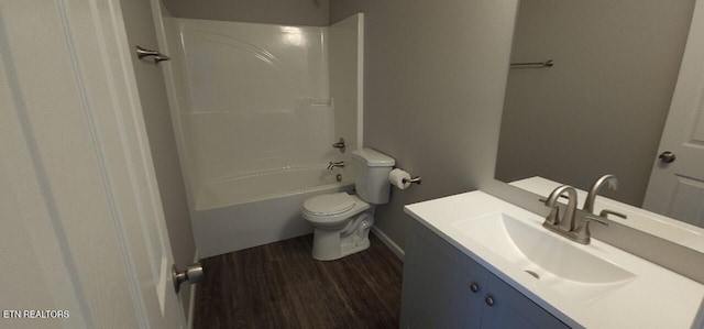 full bathroom with vanity, hardwood / wood-style floors, shower / tub combination, and toilet