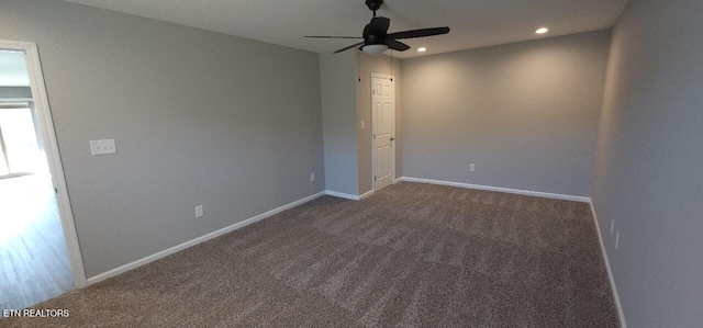 unfurnished room with ceiling fan and carpet flooring