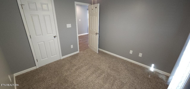 unfurnished bedroom featuring carpet