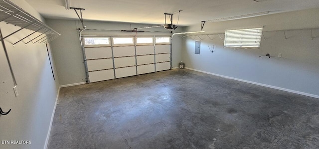 garage featuring a garage door opener and electric panel