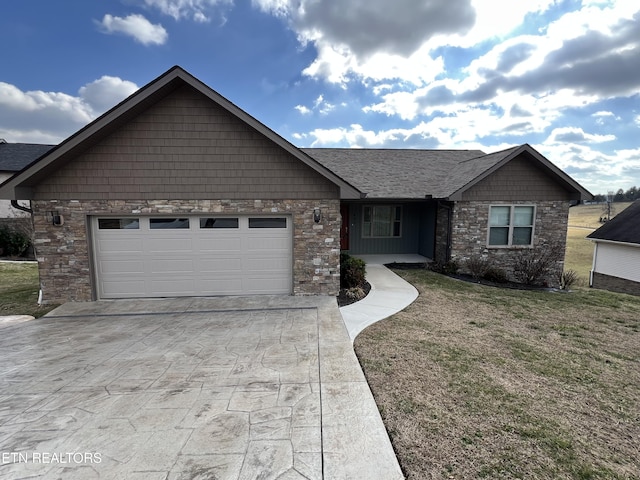 view of front of property with a garage and a front yard