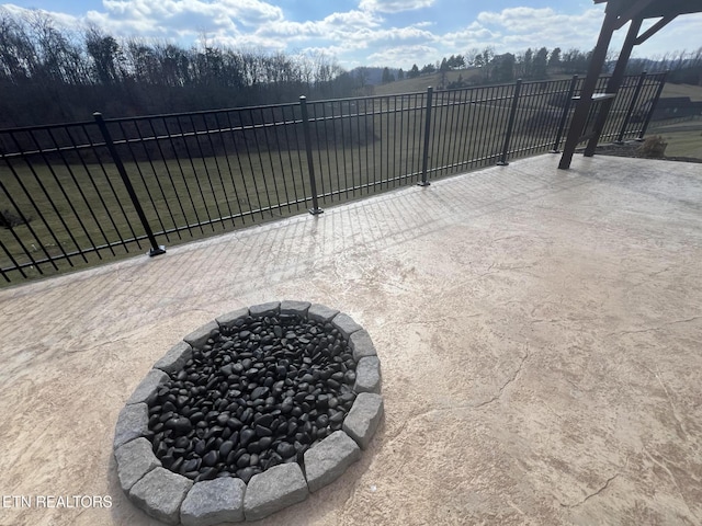 view of patio / terrace with an outdoor fire pit