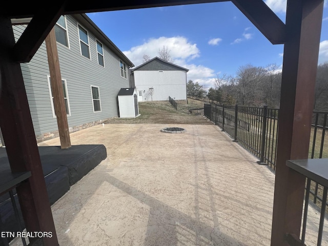 view of patio / terrace with an outdoor fire pit