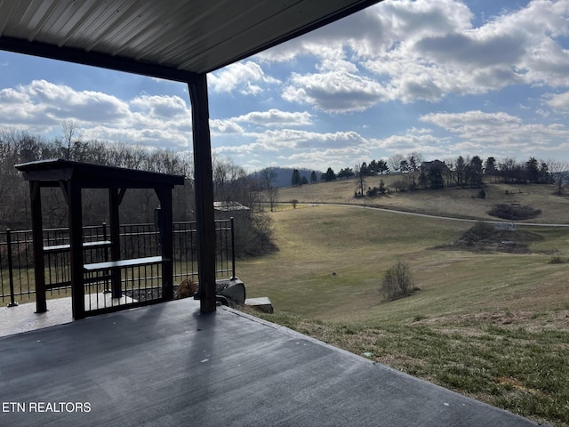 view of patio / terrace with a rural view