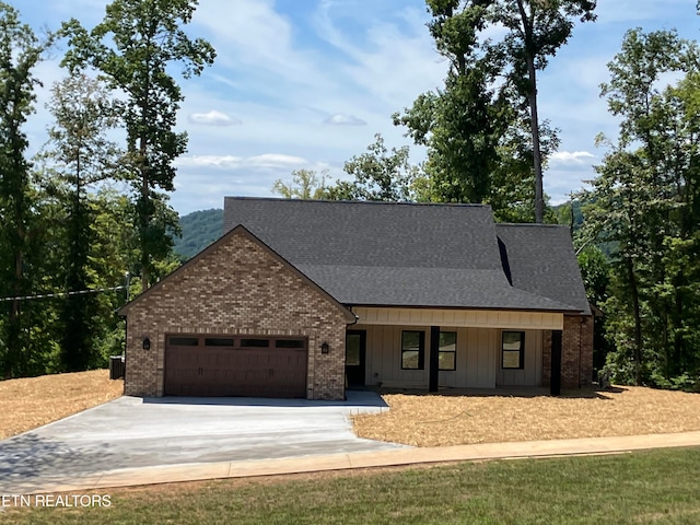 view of front of house featuring covered porch and a garage