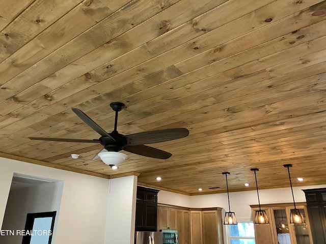 room details featuring appliances with stainless steel finishes, decorative light fixtures, ceiling fan, and wood ceiling