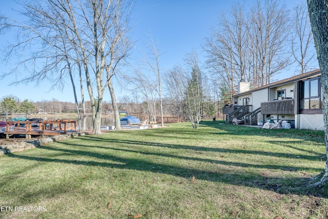 view of yard featuring a wooden deck