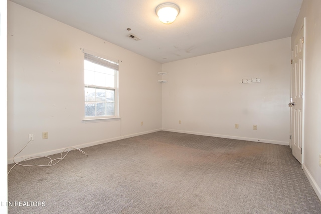 unfurnished room featuring carpet flooring