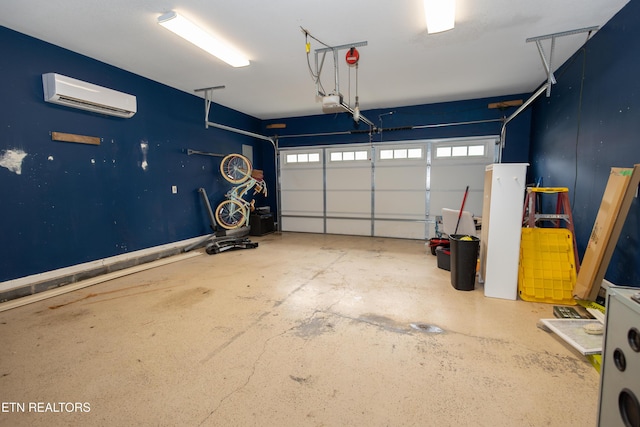 garage with a garage door opener and a wall mounted air conditioner