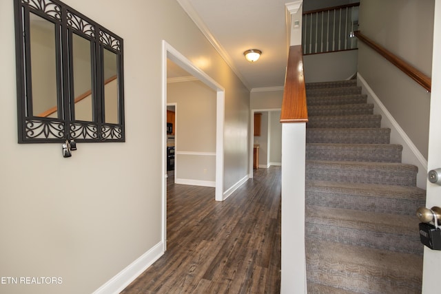 stairway featuring hardwood / wood-style flooring and ornamental molding