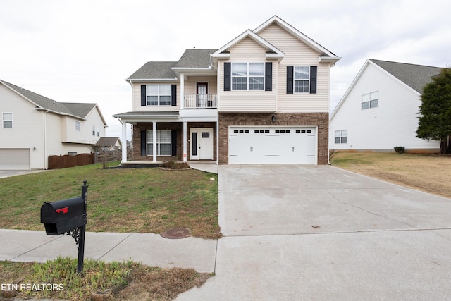 view of front of house featuring a porch, a garage, a balcony, and a front lawn