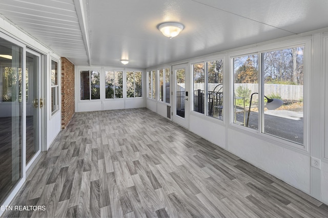 unfurnished sunroom with a healthy amount of sunlight