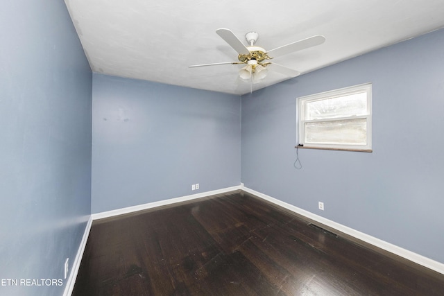 empty room featuring hardwood / wood-style flooring and ceiling fan