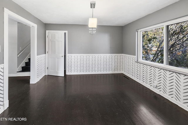 unfurnished room with dark hardwood / wood-style floors