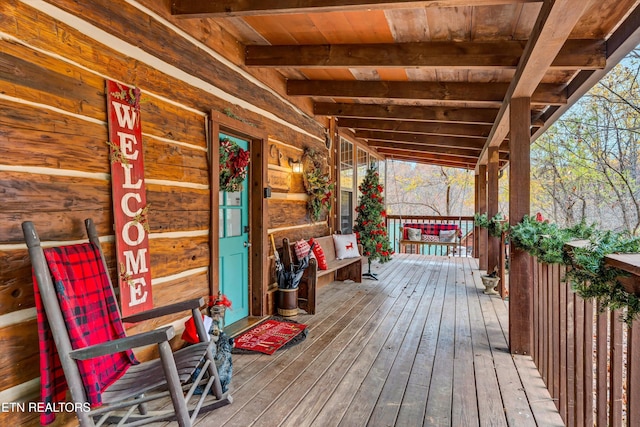 wooden terrace with covered porch