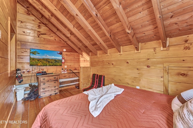 bedroom featuring lofted ceiling with beams, wood walls, wood-type flooring, and wooden ceiling